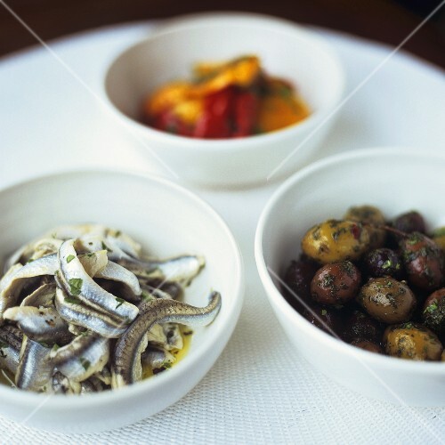 Assorted antipasti in small bowls