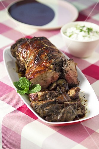 Stuffed leg of lamb with aubergines and tzatziki