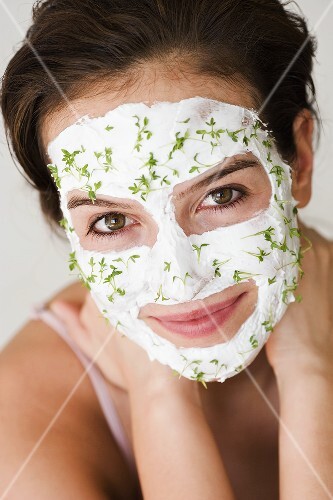 Woman with quark and cress face mask