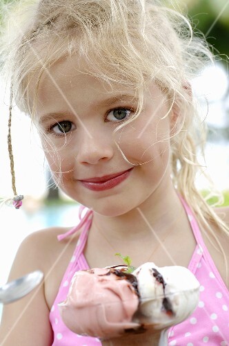 Blond girl with an ice cream sundae
