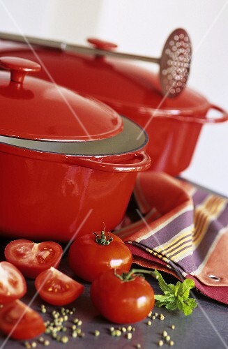 Tomatoes and spices with cast-iron pans