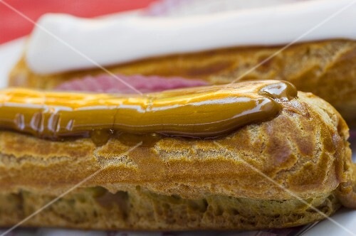 Two éclairs with different icing