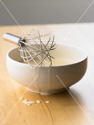 Batter in a bowl with a whisk