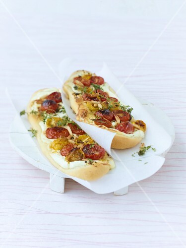 Focaccia topped with tomatoes, fresh goat's cheese & pine nuts