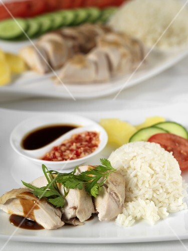 Chicken breast with rice, vegetables and two sauces