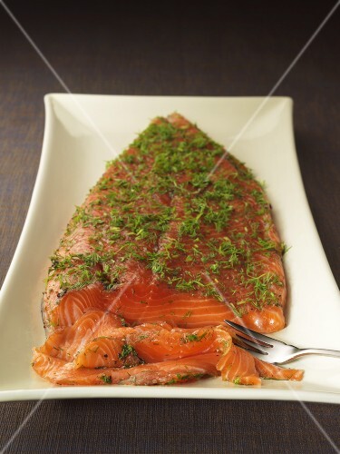 Gravlax with dill, partly sliced
