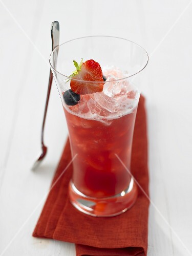 A glass of strawberry and blueberry drink
