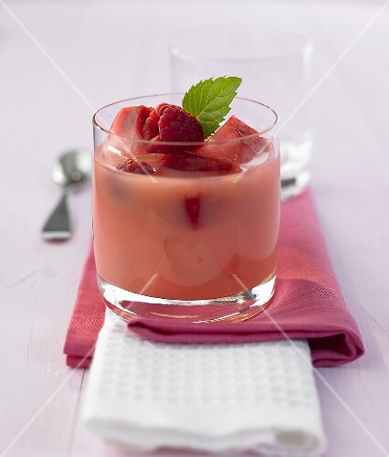 Banana and orange shake with raspberry ice cubes
