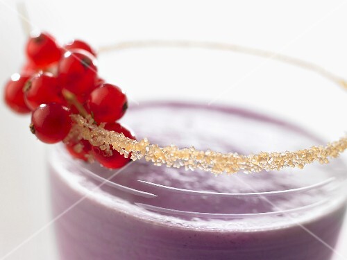 Banana and berry smoothie with sugared rim