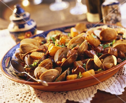 Clams with diced pork and potatoes (Portugal)