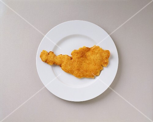 Wiener Schnitzel (breaded veal escalope) in shape of Austria