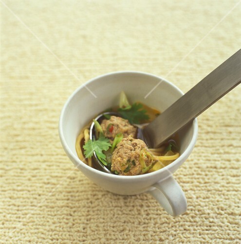 Soup with pork meatballs in a cup