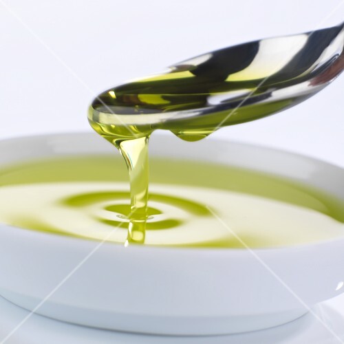 Olive oil in spoon