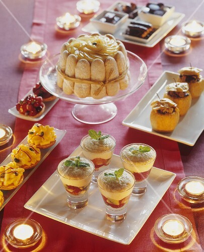 Festive dessert buffet with charlotte, baked apples etc.