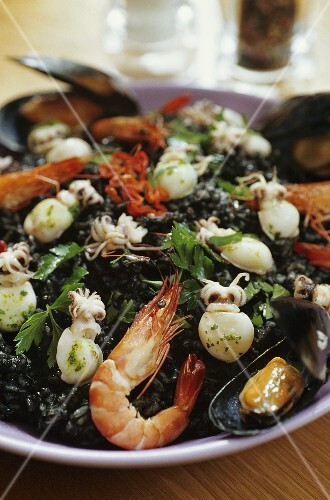 Black risotto (squid ink risotto) with seafood