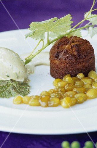 Dessert plate: lime ice cream, sponge pudding, grape compote