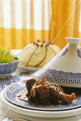 Lamb shank with raisins braised in a tajine