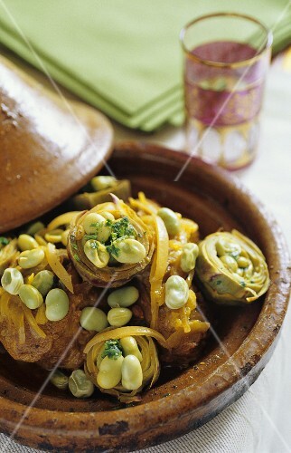 Lamb and artichokes stuffed with beans in a tajine