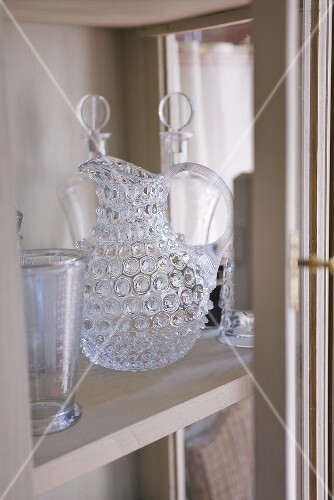 Crystal carafe and glasses on shelf (Château de la Verrerie,France)