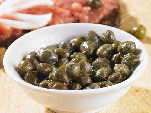 Capers in porcelain bowl