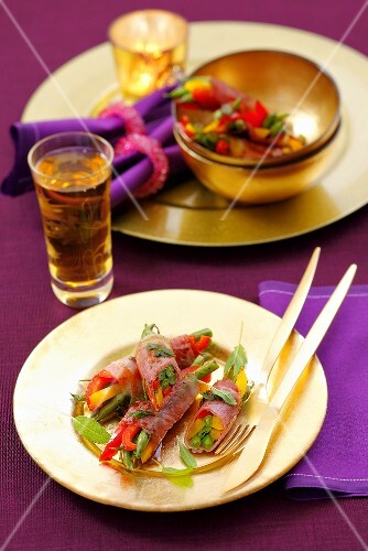 Ham rolls filled with green beans and mixed peppers