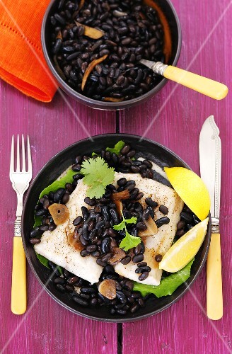 Cod with black beans, garlic and coriander