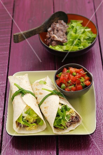 Burritos with bean puree and tomato salsa
