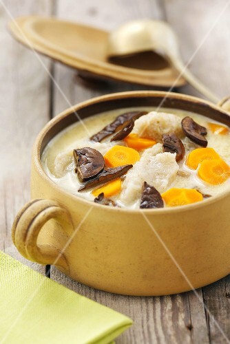 Soup with dried mushrooms, carrots and potato noodles