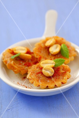 Biscuits topped with peanut butter and chilli powder