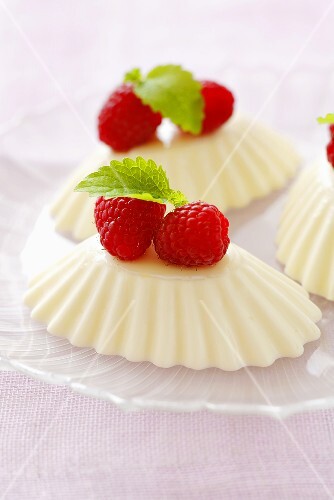 Quark moulds with raspberries and lemon balm