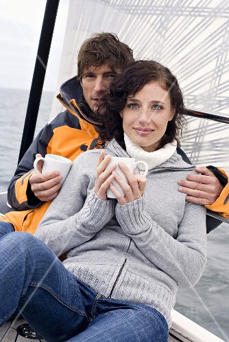 Young couple on sailing boat