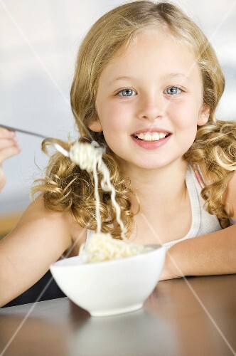 Girl eating instant noodles