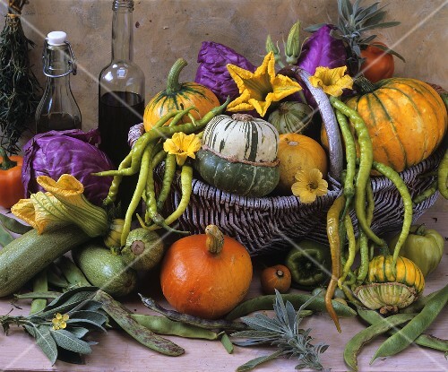 Still life with squashes, beans and chillies