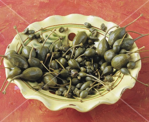 Capers and caper berries on a plate