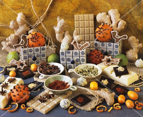 Still life with chocolate, spices and studded oranges