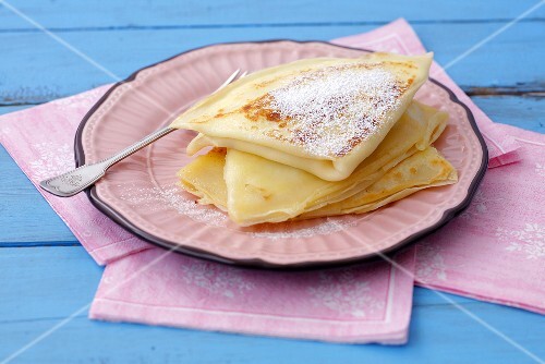 Crêpes filled with soft cheese and dusted with icing sugar