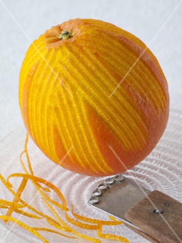 Orange with zest and zester