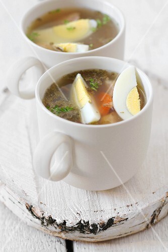Zurek with boiled eggs and sausage