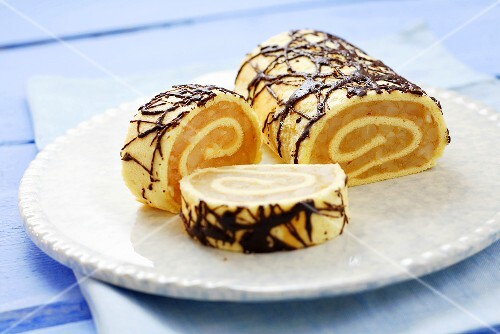Sponge roulade with apple filling and chocolate decoration