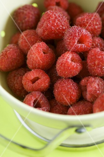 Fresh raspberries in a colander