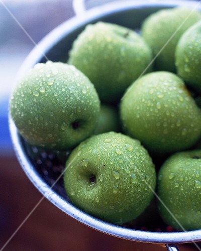 Granny Smith apples in colander