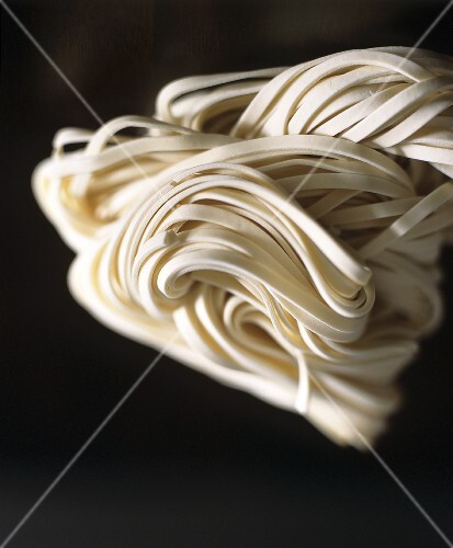 Udon noodles on black background