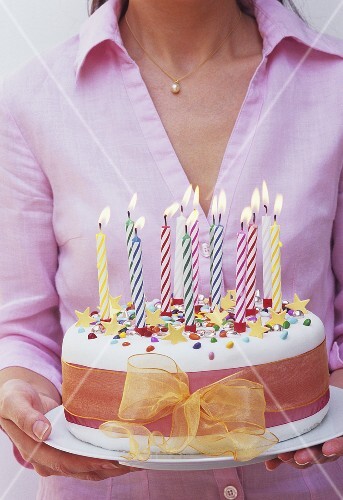Birthday cake with burning candles