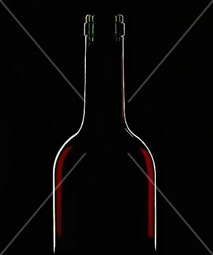 A bottle of red wine against a black background