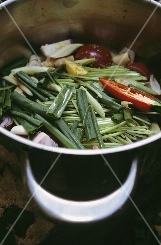 Sliced vegetables in a pan (spring onions etc.)