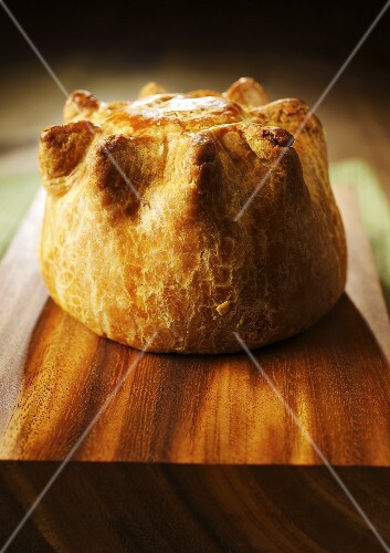 Pork pie on chopping board (UK)