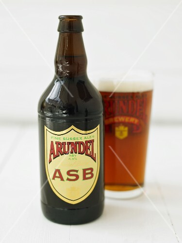 A beer bottle and a glass of beer
