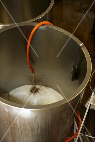 Beer running into a stainless steel tank