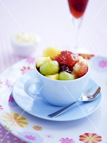 Fruit salad with honey in a cup