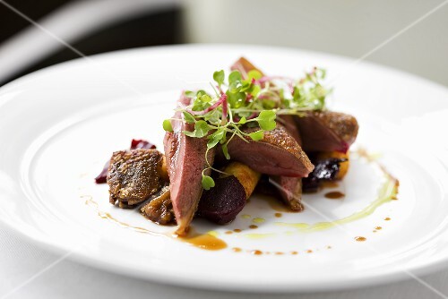 Roast pigeon on pickled beetroot